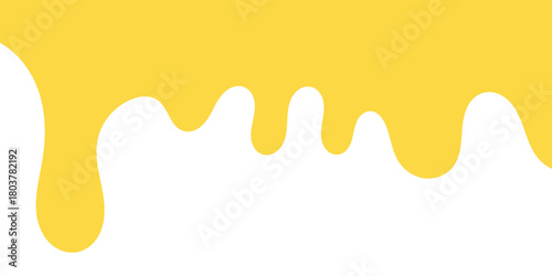 A dripping yellow substance, resembling honey or paint, against a white background.
