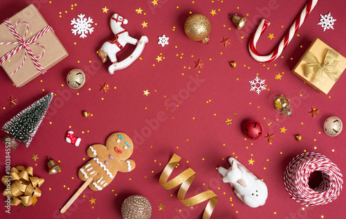 Christmas and New Year holiday decorations on deep red background with space in center