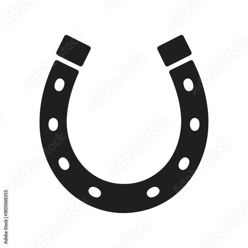 Black horseshoe isolated on white background, a symbol of luck and fortune, often associated with horses, equestrianism, and the traditions of blacksmithing.