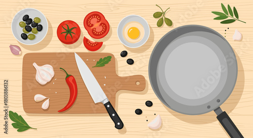 Overhead view of cooking ingredients arranged on a wooden surface, including tomatoes, olives, garlic, a chili pepper, and a frying pan, ready for preparation.