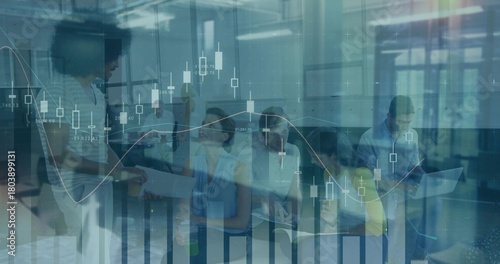 Discussing project, business-casual team reviewing financial charts in office with laptop, papers