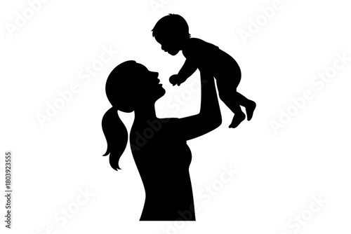 Black silhouette of a loving mother lifting her happy baby high in the air