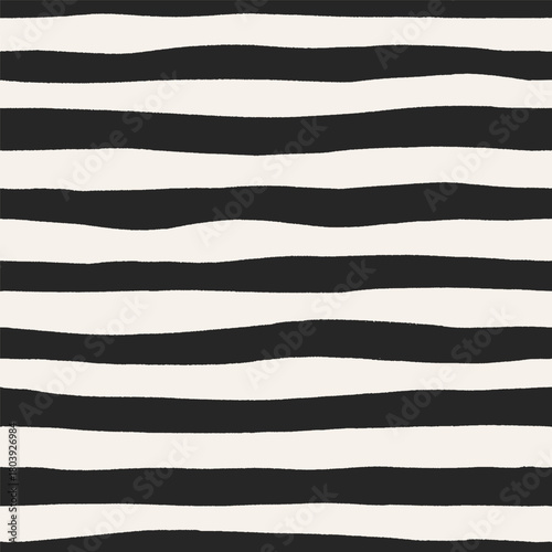 Seamless pattern, black and white irregular hand-drawn stripes. Endless backg...