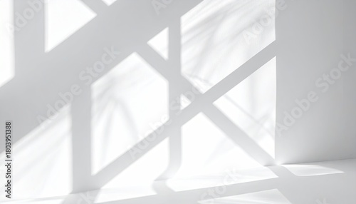 Abstract light/shadow patterns on white walls in a room