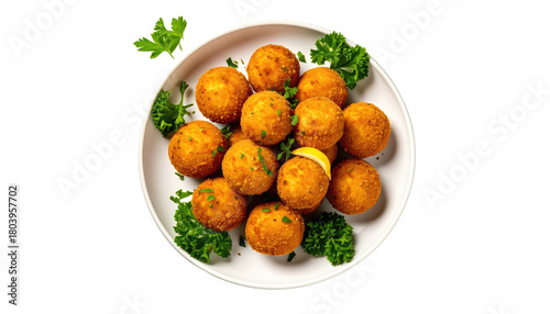 Arancini golden balls on plate, parsley and lemon garnish around