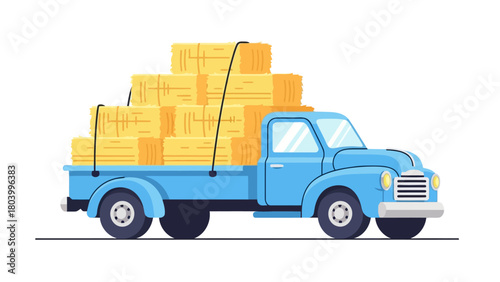 A blue truck carrying a stack of rectangular hay bales