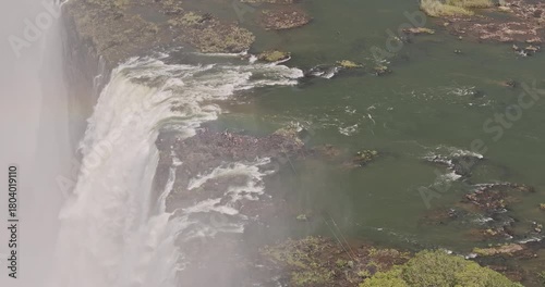 Wallpaper Mural Victoria Falls Zimbabwe Aerial v5 zoomed birds eye view flyover around Devil's Pool capturing powerful flow of Zambezi River as it plunges into the gorge - Shot with Mavic 3 Pro Cine - Jan 3rd 2024 Torontodigital.ca