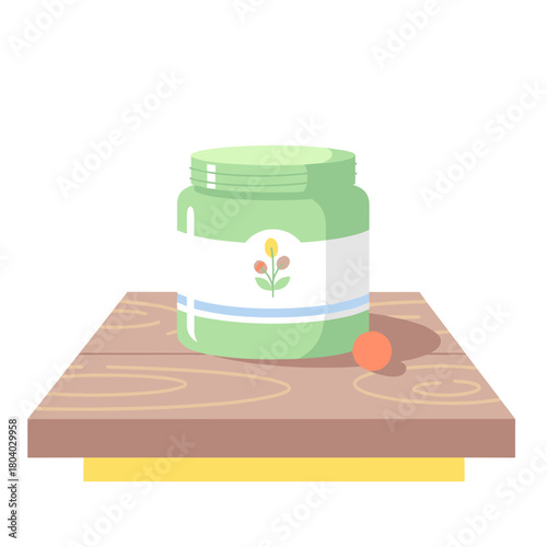 Green herbal balm jar placed on wooden table with a solid background  