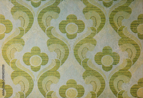 Old wallpaper on the wall. Old wallpaper for texture or background.