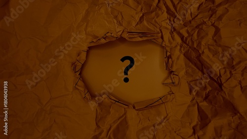 A dark question mark is visible through a tear in crumpled paper, symbolizing mystery and the unknown.