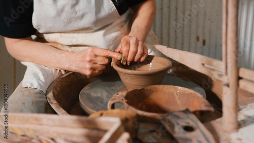Close Up Of Male Potter Shaping Clay For Pot On Pottery Wheel In Ceramics Studio