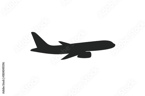 Black silhouette of commercial passenger airplane in flight side view