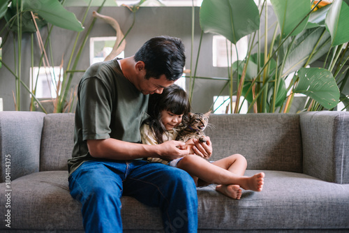 Cozy Home Scene with Family and Their Pet Cat