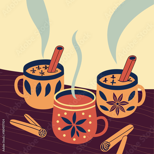 Cozy hot drinks with cinnamon sticks on wooden table background  