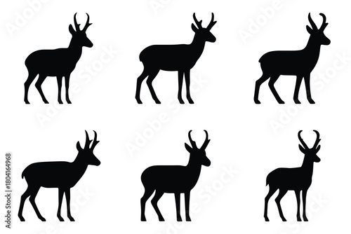 Silhouettes of six antelope standing against a white background