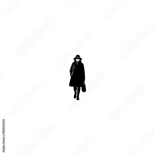 Stylish woman confidently walking with handbag in monochrome, embodying chic urban style and modern fashion