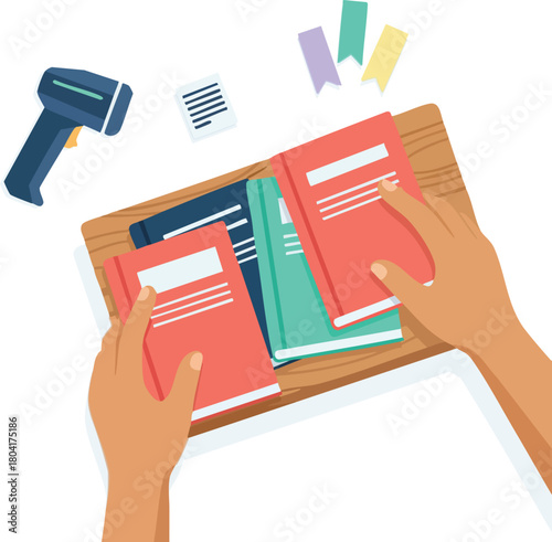 Hands organizing colorful books on a tray, with labels and a barcode scanner nearby
