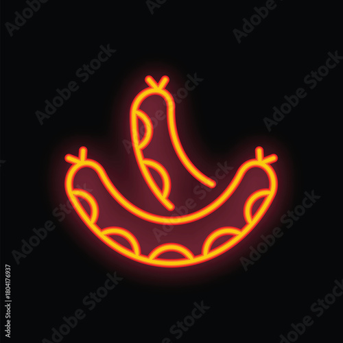Glowing neon sign depicting two appetizing sausages, radiating warmth and inviting ambiance against a dark backdrop