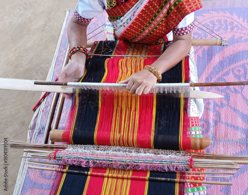 Handloom weaver in India working in her loom
