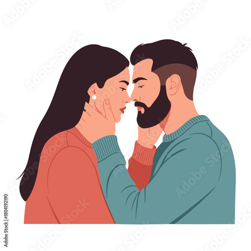 A couple sharing a tender moment with their foreheads touching.