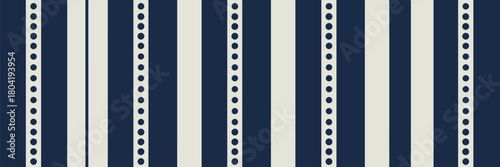 A repeating pattern of vertical stripes alternating between solid and dotted navy and cream colors