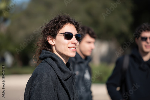 group of joyful friends raising their champagne glasses during festive christmas dinner