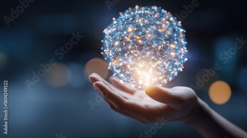 A hand cradles a glowing, spherical network of light in a futuristic, blurry background