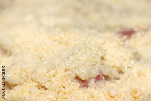 Grated cheese topping risotto. cheese on creamy rice dish. Cheese with risotto and blurred background. Grated cheese over the risotto.