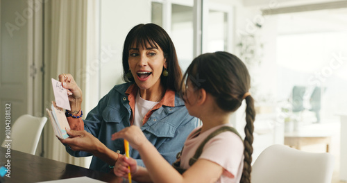 Homework, alphabet card and mother with girl in home for lesson, learning and help with activity. Family, language and mom with child, phonics and education for studying and teaching letters in house