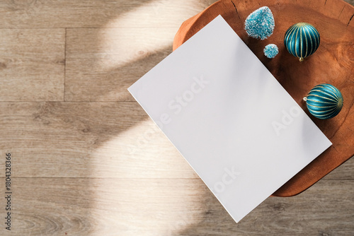 Blank magazine mockup with Christmas and New Year decorations on table with shadow