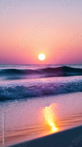 Stunning sunset over the calm ocean waves at a beach location during a peaceful evening