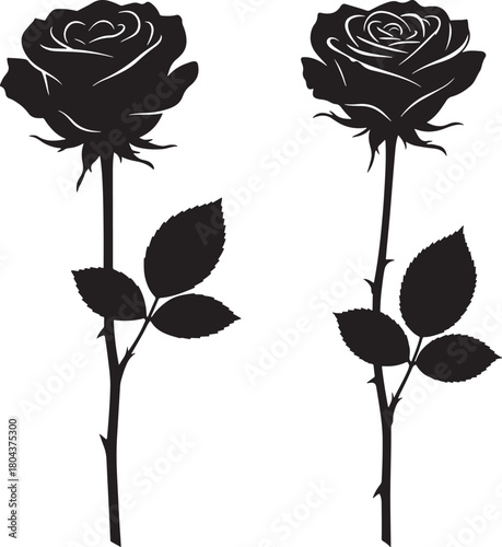 Two black rose silhouettes with stems and leaves
