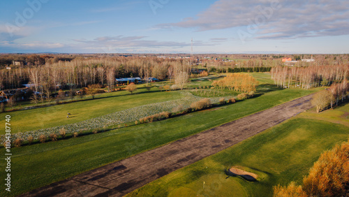 Fotografija Valmiera, Latvia - November 18, 2025: Scenic golf course view with lush green fa