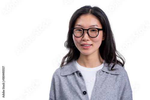 Asian woman with glasses smiling gently, wearing a grey shirt, isolated on a clean white background. Perfect for template, layout, or design concept