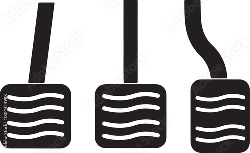 Set of three black car pedals, clutch, brake, and accelerator