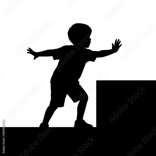 Silhouette of boy reaching toward ledge symbolizing safety risk with copy space