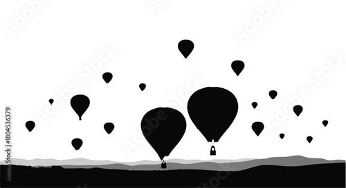 Silhouettes of hot air balloons ascend into a hazy sky over rolling hills.