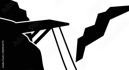 A black and white graphic showing a bridge spanning a chasm.