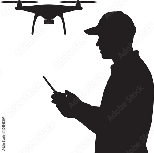 Silhouette of a man in a baseball cap operating a drone with a remote control