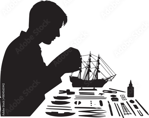 Silhouette of a man intensely building a detailed model ship hobby assembly craft
