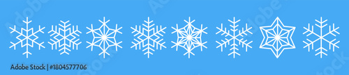 Snowflakes decorate a bright blue backdrop creating a winter wonderland effect for seasonal designs and themes