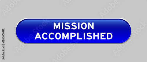 Blue color capsule shape button with word mission accomplished on gray background