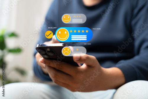 Customer satisfaction review and rating concept showing user giving five-star feedback on smartphone. Digital evaluation for online reputation, service quality, and business growth.