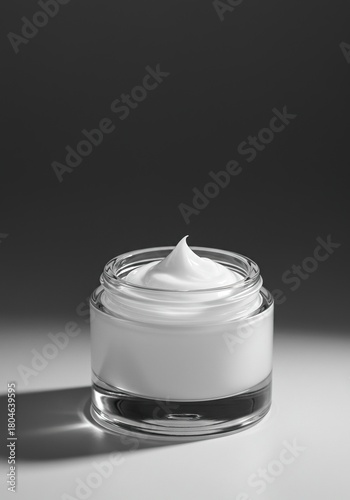 Luxurious white cream moisturizer in a minimalist glass jar, subtly reflecting soft light, suggesting hydration and skin wellness ,care ,natural ,personal care