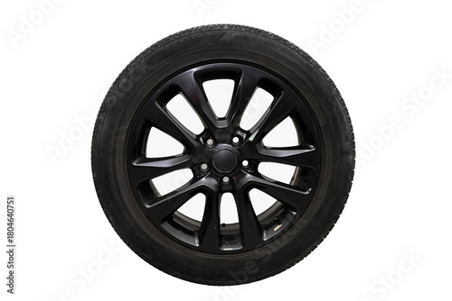 Car wheel featuring a black alloy rim and rubber tire isolated on white background