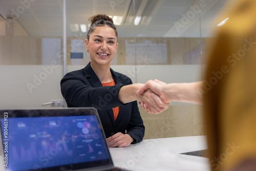 Graduate shaking hands in an interview