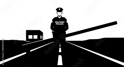 Military police officer stands guard on a road with a gate and a building in the background.