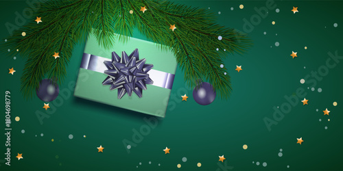 Christmas decorations with gift, balls and fur on green background. Mockup for your xmas design.