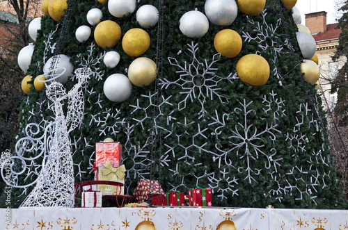 Idea for a New Year and Christmas greeting with part of a festively decorated Christmas tree, Sofia, Bulgaria  
