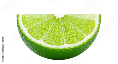 A close up of a half slice of a green lime with a white rind on a black background in bright light